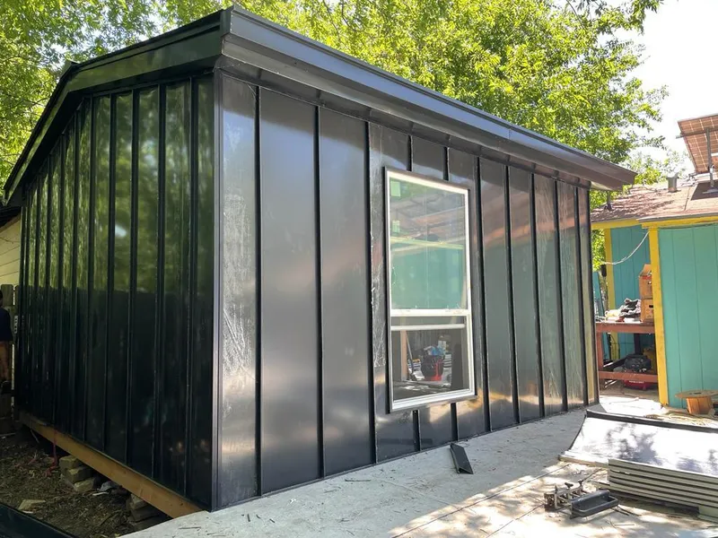 Black standing seam metal wall panels for Metal Roof Installation in Hamilton