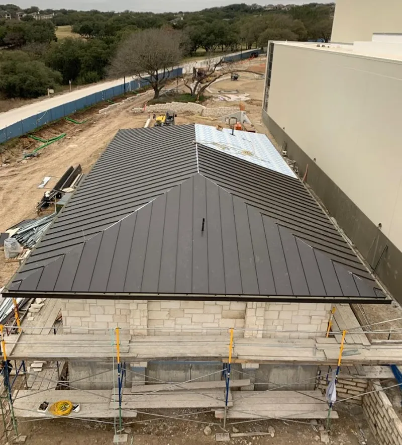 Metal roof new construction with scaffolding in Hamilton
